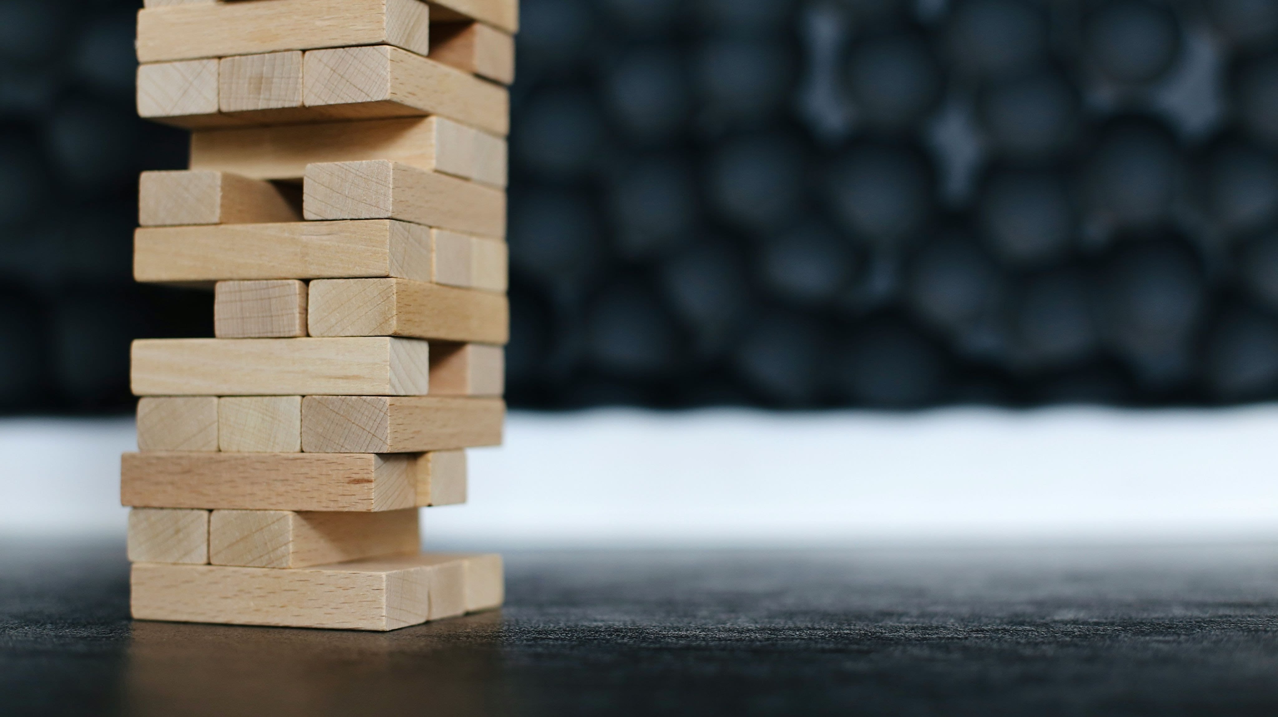 brown wooden blocks on black table